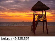 Isla Mujeres island Caribbean beach sunset baywatch tower Riviera Maya Mexico. Стоковое фото, агентство Ingram Publishing / Фотобанк Лори