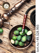 oriental nargile with feijoa. hookah with a tobacco flavor of a feijoa. Стоковое фото, агентство Ingram Publishing / Фотобанк Лори