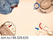 Fashionable Women’s Cosmetics and Accessories. Falt Lay. Stylish Sunglass. Jeans. Pink Shoes. Handbag and Hat. Стоковое фото, агентство Ingram Publishing / Фотобанк Лори