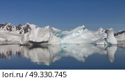 Big Iceberg in Antarctica Winter Scenery, Amazing Shape Ice Formation of Massive Large Enormous Blue Icebergs in Antarctic Peninsula Landscape Seascape with Ocean Sea Water. Стоковое видео, видеограф Vladimir / Фотобанк Лори