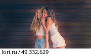 Best friends teen girls happy having fun together filtered image. Стоковое фото, агентство Ingram Publishing / Фотобанк Лори
