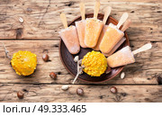 unusual ice cream with pumpkin. extraordinary ice cream with pumpkin taste and hazelnut. Стоковое фото, агентство Ingram Publishing / Фотобанк Лори