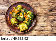 cabbage rolls with vegetable. Vegetable cabbage rolls in leaf of savoy cabbage.Flat lay with copy space. Стоковое фото, агентство Ingram Publishing / Фотобанк Лори