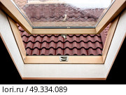 open wooden attic window overlooking the street. Стоковое фото, агентство Ingram Publishing / Фотобанк Лори