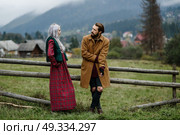 pair of lovers in the Carpathian mountains in national costumes. Стоковое фото, агентство Ingram Publishing / Фотобанк Лори