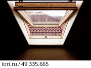open wooden attic window overlooking the street. Стоковое фото, агентство Ingram Publishing / Фотобанк Лори