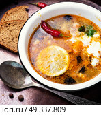 solyanka traditional Russian soup. food of national Ukrainian cuisine.Soup with meat and vegetables. Стоковое фото, агентство Ingram Publishing / Фотобанк Лори