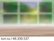 Wood Table Top on Blur Natural Green Background for Display, Montage Your Products Template for Ads, Announcement Sale, Promotion New Product or Magazine Background. 3D Realistic Vector Iillustration. EPS10. Wood Table Top on Blur Natural Green Background for Display, Mon. Стоковая иллюстрация, агентство Ingram Publishing / Фотобанк Лори
