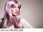 Beauty Fashion Model Girl with Colorful Dyed Hair. Girl with perfect Makeup and Hairstyle. Model with perfect Healthy Dyed Hair. Rainbow Hairstyles. Стоковое фото, агентство Ingram Publishing / Фотобанк Лори