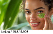 Woman applying aloe vera on her face in a tropical setting for skincare. Женщина наносит алоэ вера на лицо в тропическом саду для ухода за кожей. Стоковое AI-изображение, AI-художник Katsiaryna Repich / Фотобанк Лори