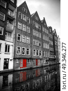 Amsterdam. black and white photo with elements of red. Стоковое фото, агентство Ingram Publishing / Фотобанк Лори