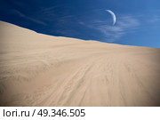 Tourists travel through the dunes in the Atacama Desert. Oasis of Huacachina, Peru, South America. moon shines. Стоковое фото, агентство Ingram Publishing / Фотобанк Лори