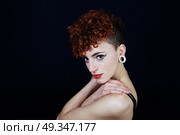 Young redhead woman with a different style. Стоковое фото, агентство Ingram Publishing / Фотобанк Лори