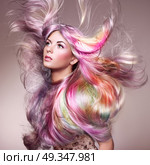Beauty fashion model girl with colorful dyed hair. Beauty Fashion Model Girl with Colorful Dyed Hair. Girl with perfect Makeup and Hairstyle. Model with perfect Healthy Dyed Hair. Rainbow Hairstyles. Стоковое фото, агентство Ingram Publishing / Фотобанк Лори