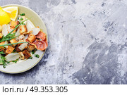 Unusual meat salad. Salad with fried bacon, croutons and Jerusalem artichoke. Стоковое фото, агентство Ingram Publishing / Фотобанк Лори