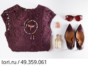 Fashion flat lay scene. Fashion flat lay scene. Dress, hight heel shoes and sunglasses, dressing up for party fashion accessoires. Стоковое фото, агентство Ingram Publishing / Фотобанк Лори