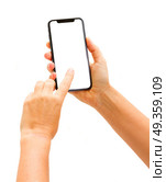 WARSAW, POLAND - DECEMBER 02: Two hands holding and touching new Iphone X modern mobile phone over white background. New Iphone X. New Iphone X. Редакционное фото, агентство Ingram Publishing / Фотобанк Лори