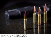 Ammunition cartridges on black background. Ammunition cartridges. Стоковое фото, агентство Ingram Publishing / Фотобанк Лори