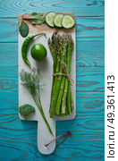 Healthy food vegetables for heart heath on wood. Healthy food vegetables for heart heath on wooden turquoise background. Стоковое фото, агентство Ingram Publishing / Фотобанк Лори