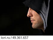 Profile of the man in a hood on a black background      . Secret. Стоковое фото, агентство Ingram Publishing / Фотобанк Лори
