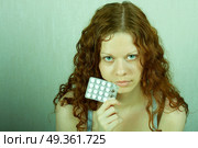 The thoughtful girl holds in a hand of a tablet and reflects on the developed situation. Condition of a hopelessness. Стоковое фото, агентство Ingram Publishing / Фотобанк Лори