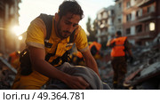 Rescue workers assist victims in the aftermath of a building collapse during sunset in an urban disaster zone. Стоковое AI-изображение, AI-художник Сергей Толмачёв / Фотобанк Лори