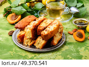 Variety of biscotti - cantucci, cantuccini, kind of biscuit, with the addition of almonds and dried fruits. Italian cantuccini cookies. Стоковое фото, агентство Ingram Publishing / Фотобанк Лори