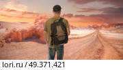 A male tourist is traveling through the Atacama Desert. Chile. Стоковое фото, агентство Ingram Publishing / Фотобанк Лори