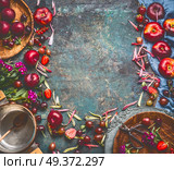 Various summer fruits and berries: strawberries, peaches, plums, cherries, gooseberries and currants on rustic kitchen table with cooking pot and spoon, top view, frame. Seasonal local organic food. Стоковое фото, агентство Ingram Publishing / Фотобанк Лори