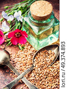 Flax seed,oil and flax flowers in mortar.Linseeds. Heap of linseeds. Стоковое фото, агентство Ingram Publishing / Фотобанк Лори