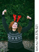 Young redhead woman wearing a christmas costume . Стоковое фото, агентство Ingram Publishing / Фотобанк Лори
