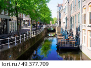 street with canal in Delft old town in Holland. Delft old town in Holland. Стоковое фото, агентство Ingram Publishing / Фотобанк Лори