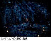 Scary witch in night forest. Стоковое фото, агентство Ingram Publishing / Фотобанк Лори