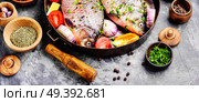 Fresh fish carp with ingredients for cooking on pan.Dietary food. Fresh raw fish and food ingredients. Стоковое фото, агентство Ingram Publishing / Фотобанк Лори