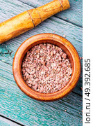 Grinded rhizomes of plant iris in mortar.Herbal medicine.Herbalism. Grinded rhizomes of iris. Стоковое фото, агентство Ingram Publishing / Фотобанк Лори