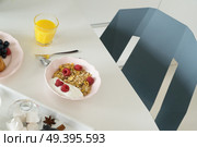 Breakfast with orange juice, porrige and coffee on dinner white table. Breakfast with cereles. Стоковое фото, агентство Ingram Publishing / Фотобанк Лори