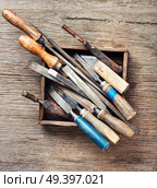 Old vintage hand tools on wooden background. Retro carpenter tool. Стоковое фото, агентство Ingram Publishing / Фотобанк Лори