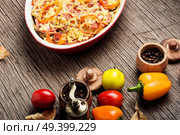 Stewed, baked zucchini, tomatoes and peppers.Traditional French vegetable dish. Diet vegetarian vegan food. Стоковое фото, агентство Ingram Publishing / Фотобанк Лори