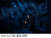 Scary witch in night forest with raven version. Стоковое фото, агентство Ingram Publishing / Фотобанк Лори