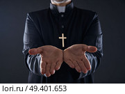 Priest open hands arms praying offering oblation. Стоковое фото, агентство Ingram Publishing / Фотобанк Лори