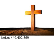 Christian wood cross on white and wooden background. Стоковое фото, агентство Ingram Publishing / Фотобанк Лори