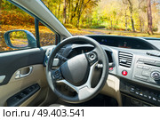 car windscreen with fall road, view inside out. car windscreen with road. Стоковое фото, агентство Ingram Publishing / Фотобанк Лори