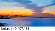 Denia sunset skyline from Las Rotas in Alicante of Mediterranean Spain. Стоковое фото, агентство Ingram Publishing / Фотобанк Лори