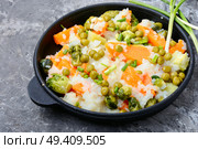 Vegetable rice risotto with pumpkin, carrots, peas and cabbage. Autumn menu. Autumn food. Lean vegetable risotto. Стоковое фото, агентство Ingram Publishing / Фотобанк Лори