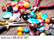 Jewelry making and beading process.Colored beads.Bead mix. Bead for making jewelry. Стоковое фото, агентство Ingram Publishing / Фотобанк Лори