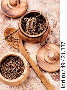 Dried rhizomes and roots of valerian medicinal.Natural herbal medicine. Dry root valerian. Стоковое фото, агентство Ingram Publishing / Фотобанк Лори