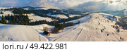 Winter mountain landscape. Panorama of hills and village in Carpathian mountains. Aerial panoramic view. Podobovets and Pilypets villages. Стоковое фото, агентство Ingram Publishing / Фотобанк Лори
