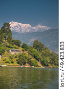 Lake Phewa - at the second largest lake in Nepal located in the Pokhara Valley near Pokhara and Sarangkot mountain. Стоковое фото, агентство Ingram Publishing / Фотобанк Лори