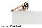 Funny nerdy guy holding an empty board isolated on white background. Стоковое фото, агентство Ingram Publishing / Фотобанк Лори