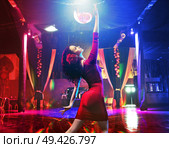 Pretty brunette dancer practicing in the latin club. Стоковое фото, агентство Ingram Publishing / Фотобанк Лори